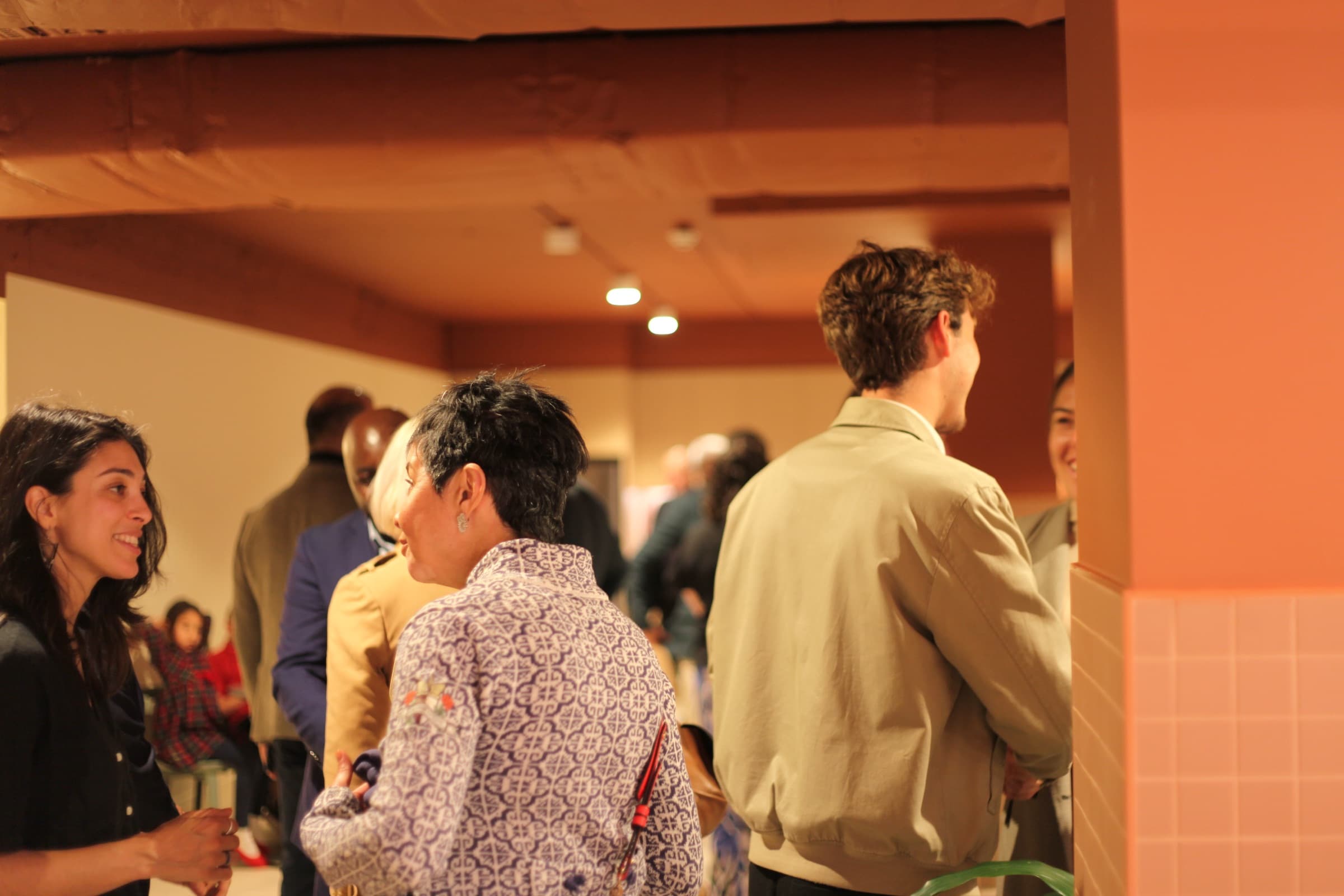 Guests in conversation at a launch night
